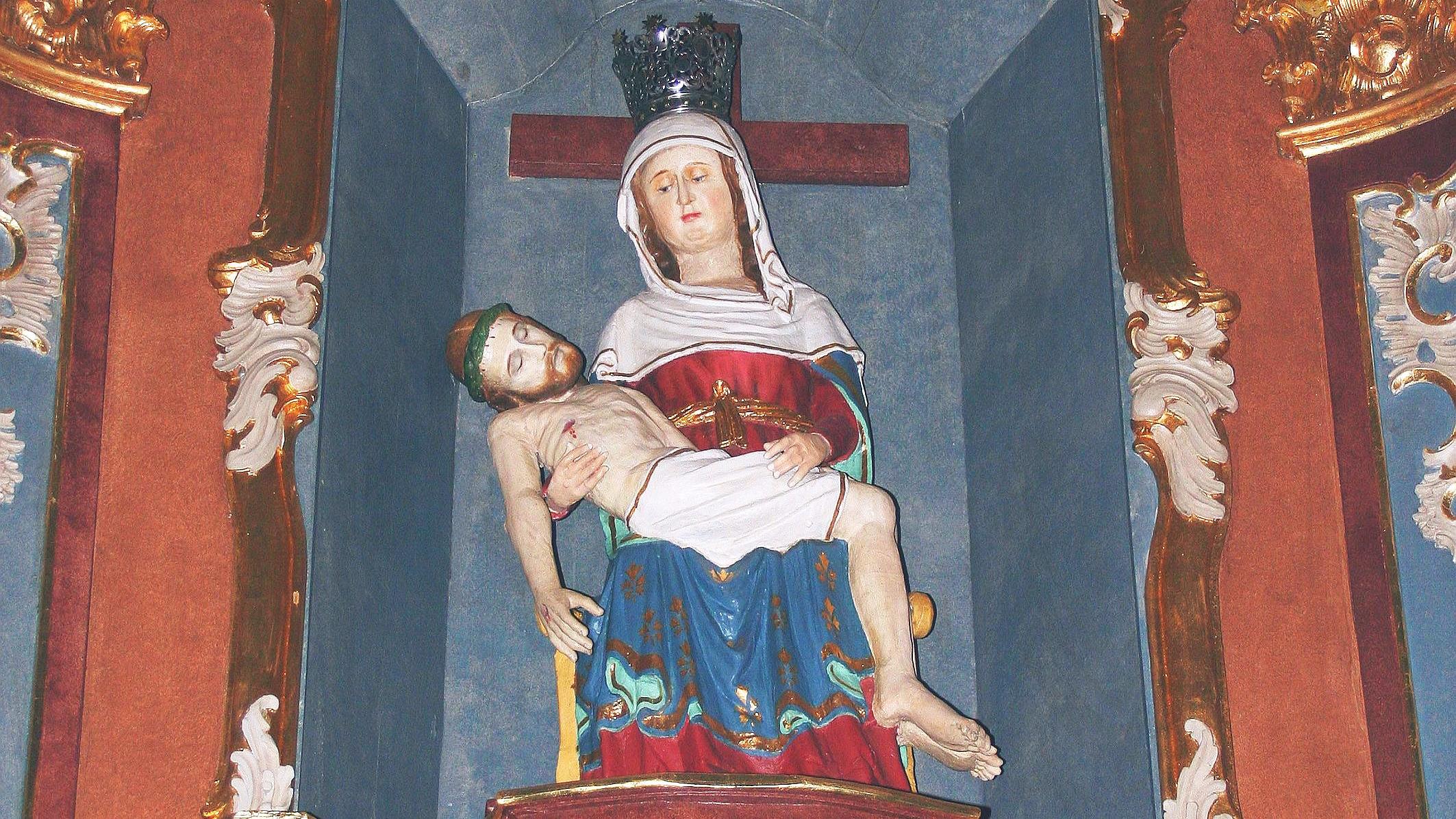 Seit vielen  Jahrhunderten wird im Eifelort Weidingen ein spätgotisches Gnadenbild der trauernden Gottesmutter verehrt, die auf ihrem Schoß den toten Jesus trägt.